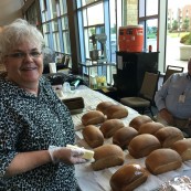 Representatives from Oklahoma Wheat with the bread donated to the event and served to attendees by the organization.