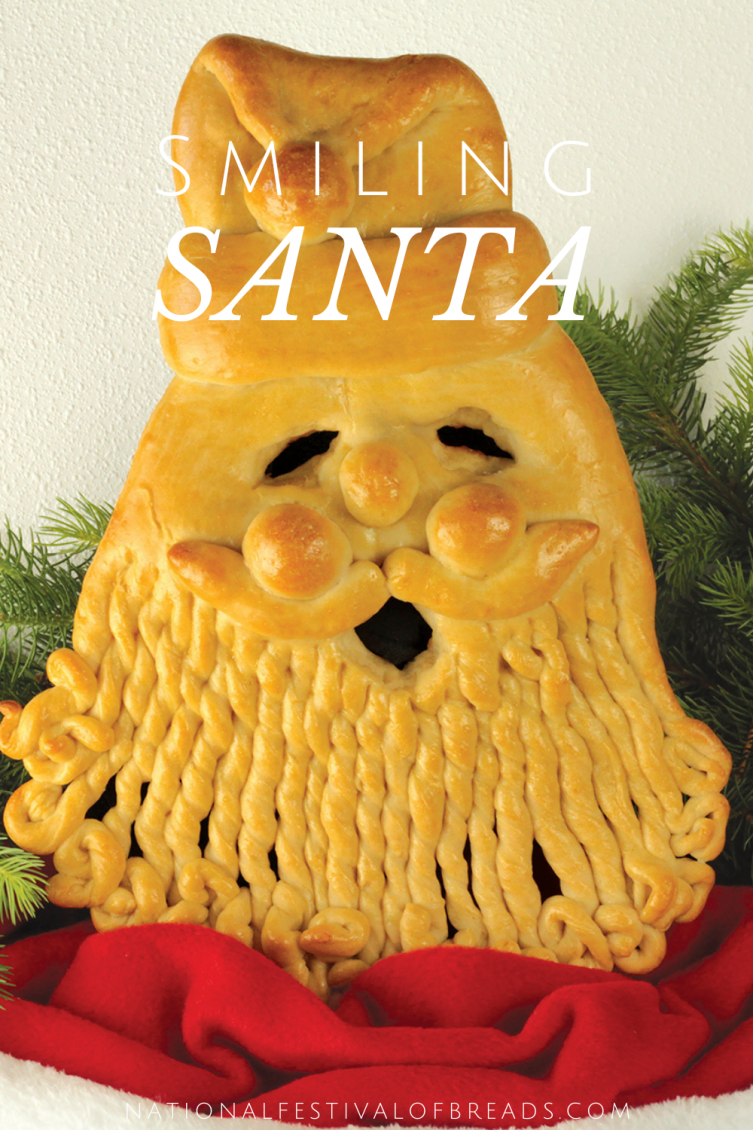 This Smiling Santa bread sculpture is perfect for the holidays! Use it either as a DIY Christmas centerpiece or munch away with party guests as they marvel at your artistic talents. This bread recipe is a winner!