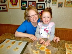 Hurd baking with one of her four grandchildren